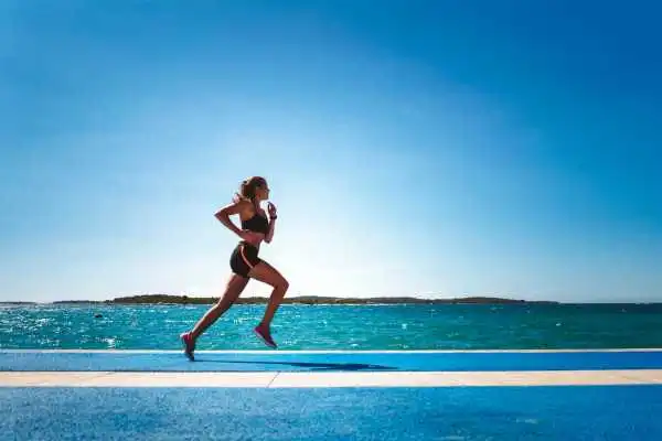 Woman running showing strong leg muscle Chesterfield